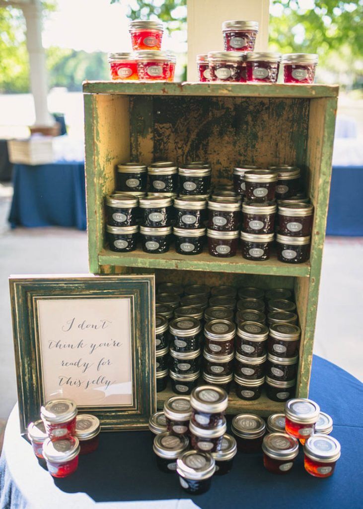 jars of jams are on display in an old wooden box with a sign that says i don't think you really do it