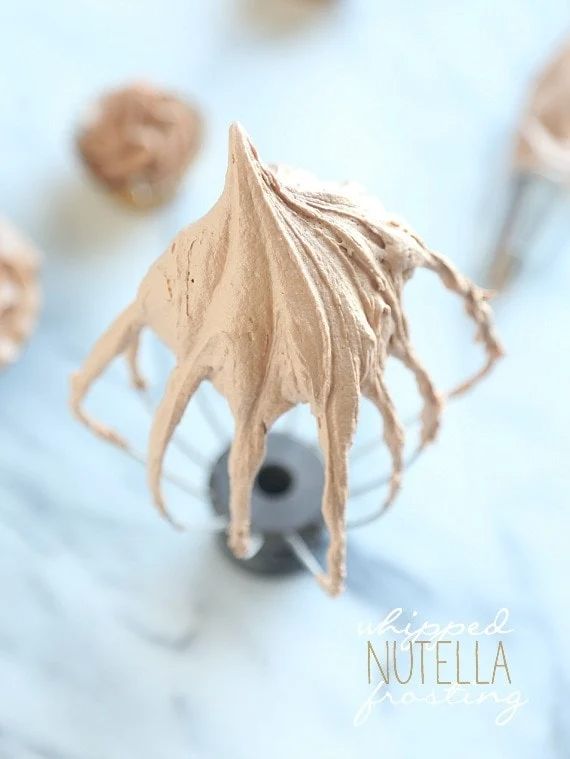 a close up view of some food items on a white tablecloth with the words nutella written below it