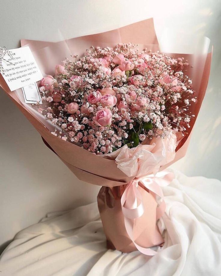 a bouquet of pink flowers is displayed on the instagram page