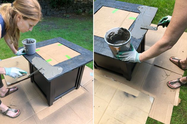 a woman is painting the side of a table with paint and some paper on it