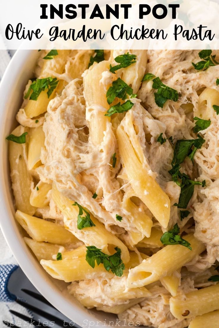 chicken pasta in a white bowl with parsley on top