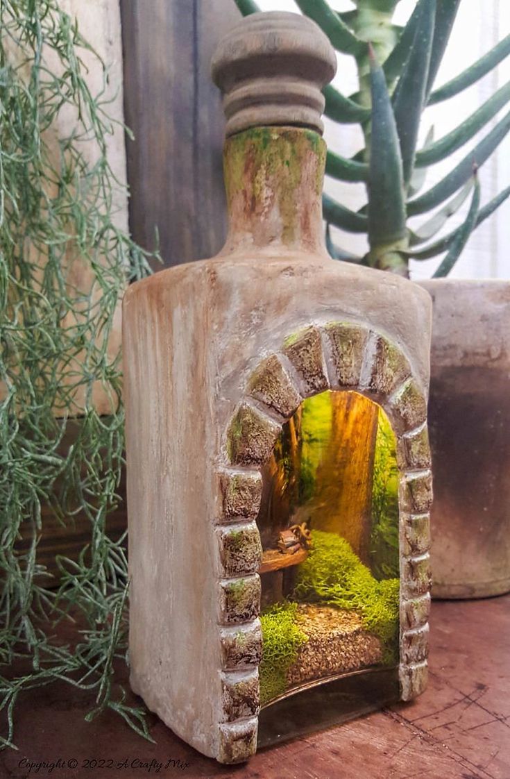 an outdoor oven with moss growing in it and a potted plant next to it