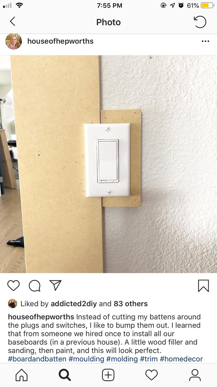 an instagramted photo of a white light switch on a wall in a house