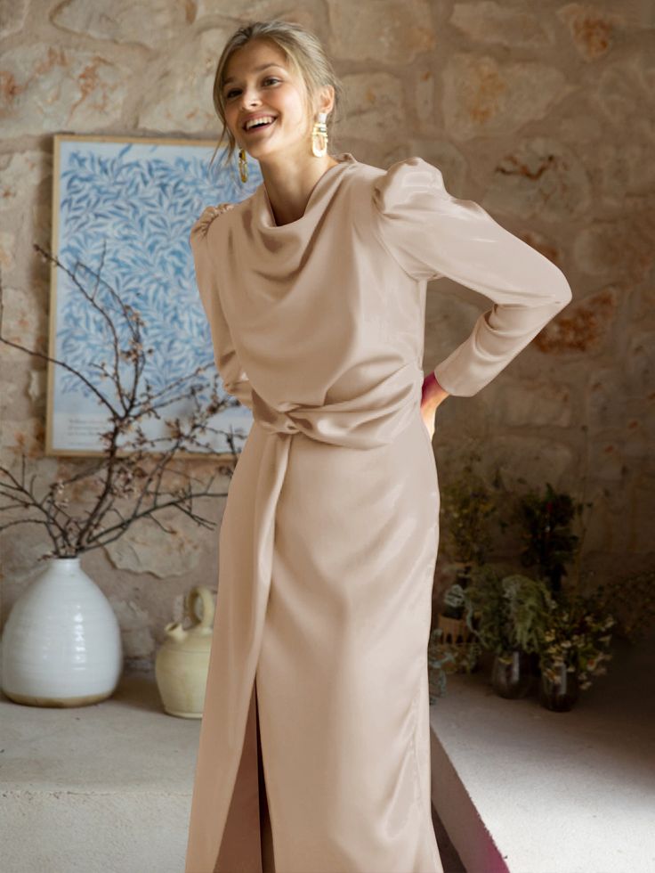 Introducing the timelessly elegant Ximena Satin Long Sleeve Midi Dress. With its luxe champagne fabric, this sophisticated and sleek piece is perfect for making an impression at any special occasion. Its high-quality material offers a luxe silk-like feel, while the midi length and long sleeves offer modest sophistication. An enduringly elegant look. Size Guide: Model is 5’7” tall, and has a 33.4” bust, 26.5” waist, & 34.6” hips. She is wearing a S / US 4 / AU 8. This dress is true to size. Mater Bridesmaid Dresses Modest, Elegant Bridesmaid Dress, Bridesmaid Dresses Satin, Fall Bridesmaid Dresses, Long Dresses Elegant, Elegant Bridesmaid Dresses, Satin Evening Dresses, Satin Long Sleeve, Dresses Modest