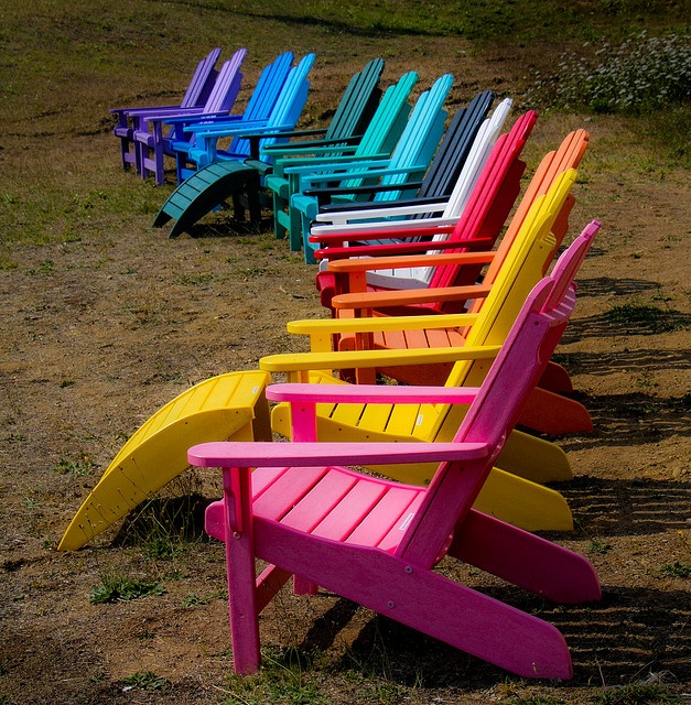 colorful beach chairs lined up in a row