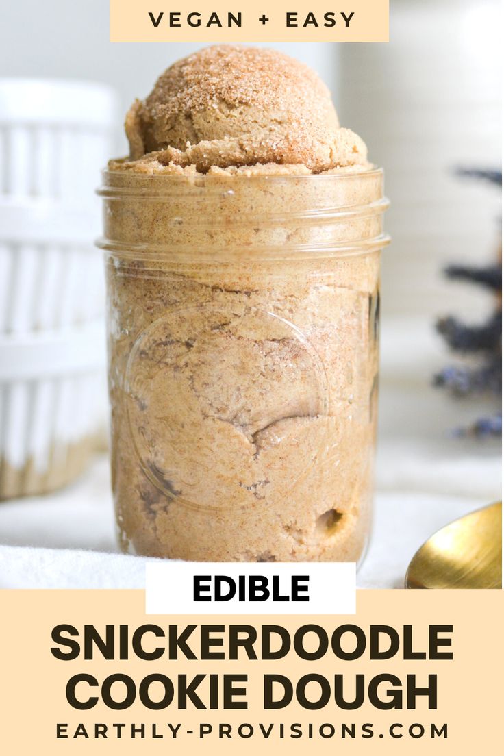 a jar filled with cookie dough on top of a table