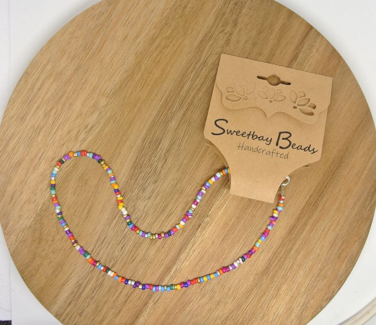 Fun and versatile multi-colored seed bead choker necklace. Made from all matte glass beads and a silver plated lobster claw clasp. Simple but colorful- can be layered for a more dramatic effect. Comes in several lengths. Please measure your neck to find the best size. Measurements include the lobster clasp.  Best seller! Trendy Chokers, Seed Bead Choker, Bead Choker Necklace, Beaded Memory Wire Bracelets, Handmade Chokers, Boho Wrap Bracelet, Beaded Memory Wire, Necklace Colorful, Blue Beaded Necklace