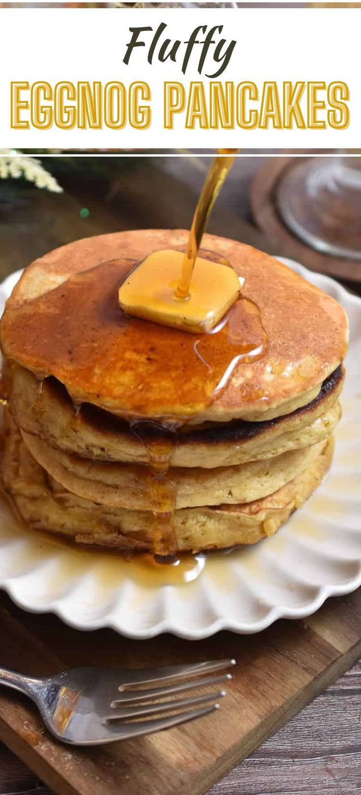 a stack of pancakes topped with butter and syrup