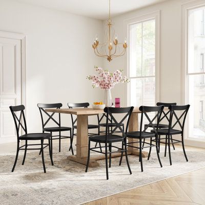 a dining room table with six chairs around it