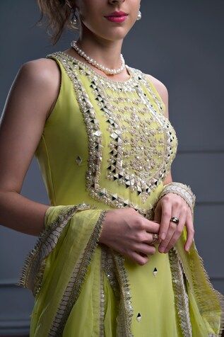 Lime green sleeveless kurta with floral bloom embroidery using mirror, pearl and resham highlights. Paired with a sharara and an embroidered border dupatta. - Aza Fashions Pista Green Gota Work Dress, Sleeveless Dabka Work Lehenga For Wedding, Bollywood Style Sleeveless Embellished Anarkali Set, Wedding Lehenga With Dabka Work, Elegant Sleeveless Palazzo Set For Festivals, Sleeveless Anarkali Dress With Gota Work, Sleeveless Georgette Dress With Mirror Work, Traditional Sleeveless Embellished Anarkali Set, Sleeveless Pista Green Anarkali Set