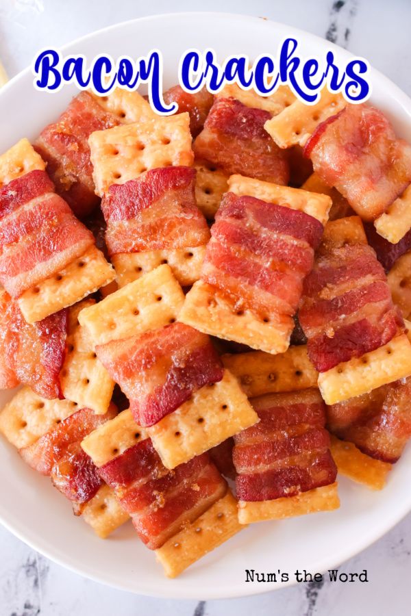 bacon crackers in a white bowl on a marble table