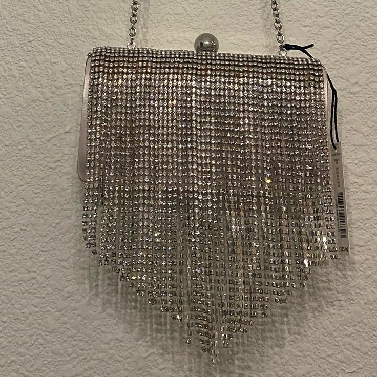 Dillard’s Brand Rhinestone Fringe Clutch Evening Bag Chain Crossbody Detachable Blush Under The Rhinestone Fringe Silver Clutch Bag For Night Out, Silver Clutch For Night Out, Silver Bling Bags For Night Out, Chic Silver Bags With Rhinestones, Silver Evening Bag With Bling For Night Out, Glamorous Evening Bag With Rhinestone Fringe, Silver Embellished Crystal Bag, Silver Crystal Embellished Bags, Silver Embellished Crystal Bags