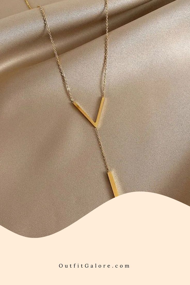 Trendsetting V-Neck Gold Clavicle Necklace Gold Y-shape Clavicle Chain Necklace, Minimalist Y-shape Clavicle Chain Necklace, Minimalist Dangle Necklaces For Parties, Trendy Long Necklace For Party, Clavicle Chain Y-shape Drop Necklace, Minimalist Pendant Chain Necklace For Party, Modern Long Necklace For Party, Gold Y-shape Necklace With Adjustable Chain, Clavicle Chain Drop Necklace In Y-shape