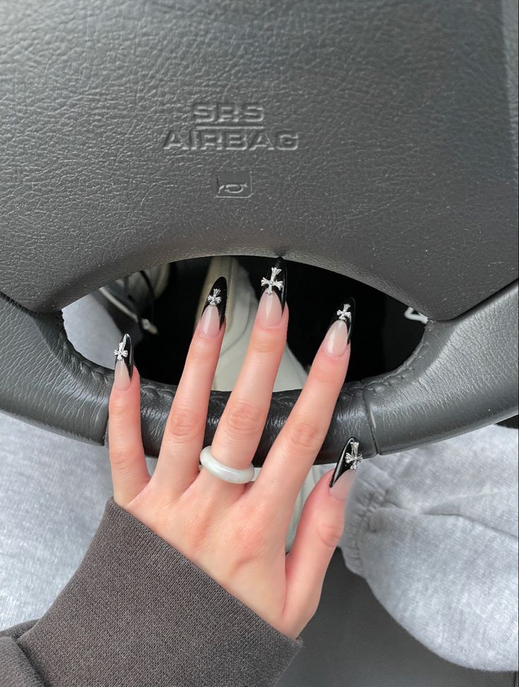 chrome heart 
nails
acrylic nails 
fall nails
gel x nails Short Nails Chrome Hearts, Almond Chrome Heart Nails, Nail Inspo Chrome Hearts, Chrome Hearts Nails Almond, Chrome Hearts Inspired Nails, Almond Nails With Cross, Chrome Hearts Nails Designs, Nails With Chrome Heart, Black Chrome Heart Nails