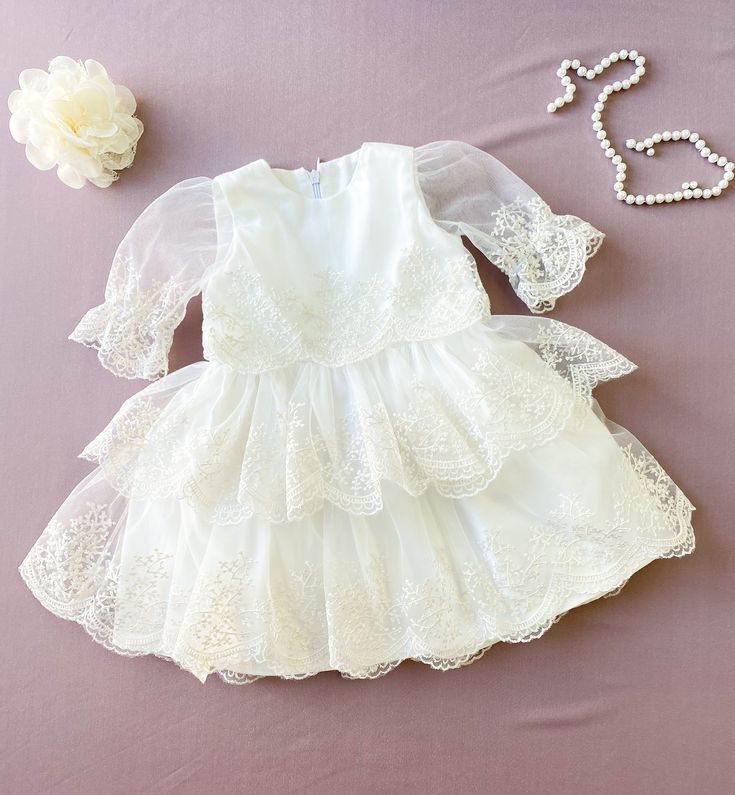 This gorgeous ivory lace dress is made for Baptism/Christening and First communion event. Fabric: ivory cotton, lace with floral print. The price is only for the dress. *Wash & care instructions: *Washing in cold water by hand. DELIVERY TIME (approximately): I need 3-5 days to sew your orders. Ship worldwide. Shipping to Europe usually takes 7-8 days, USA-7-8 days, Canada-14-20 days, Australia, NZ-2-3 weeks. Also you can choose express delivering 2-3 days for 29 dollars. It depends on the co Communion Dresses Lace, Girl Baptism Dress, Baby Blessing Dress, Christening Dress Baby Girl, Girls Baptism Dress, Baptism Dress Baby Girl, Blessing Dress