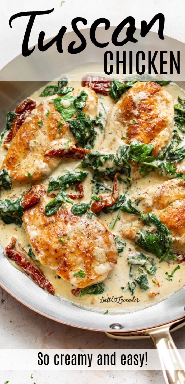 a pan filled with chicken covered in cream sauce and spinach