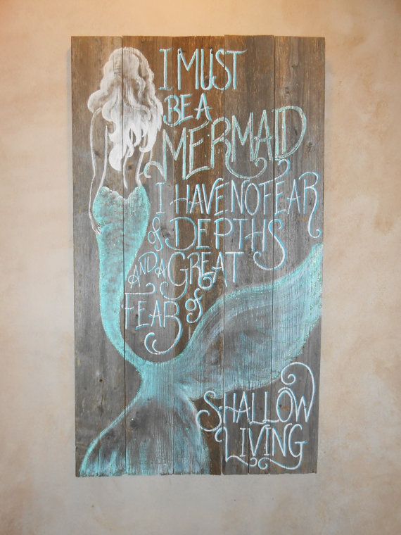 a wooden sign with writing on it that says i must be a mermaid