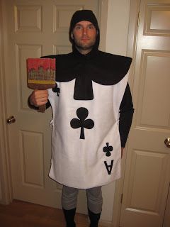 a man in a costume holding a book