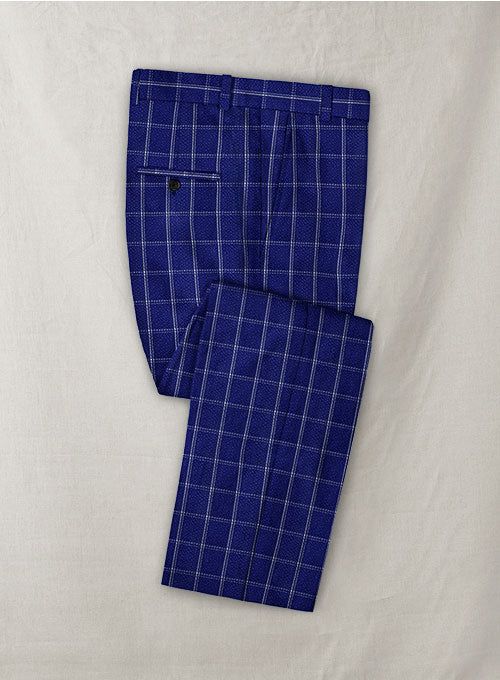 Solbiati Cobalt Blue Checks Seersucker Pants offer a fresh update on a wardrobe staple with its sophisticated appeal. They are woven from 100% cotton on twin-beam looms that weave it at different speeds, which gives the seersucker its trademark stripes and texture. Easy as the breeze, these seersucker plaid pants are the perfect transition from work to play. Cool, casual and meant for a good time. 
 
 Seersucker name comes from the persian word: "SHUR E SHAKAR" which means sugar and milk, signif Grey Tweed Suit, Herringbone Tweed Jacket, White Linen Suit, Green Velvet Jacket, Peaky Blinders Suit, Royal Blue Suit, Seersucker Suit, Blue Chinos, Seersucker Pants