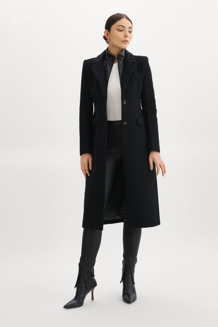 The Malva wool coat marries the best of polished glamour and feminine flair. The structured wool offers refined texture, while the semi-fitted hourglass silhouette offers a flattering fit. Elegant extras — like a removable leather bib, notched collar and flap pockets — also play a starring role. Shoulder pads add structure and the single-breasted, button-down design conveys timelessness. Black Removable inner leather dickie with zipper Single breasted button closure Notched collar Shoulder pads Black Wool Coat, Black Tweed, Black Wool, Shoulder Pads, Wool Coat, Flap Pocket, Black Coat, Trench Coat, Normcore