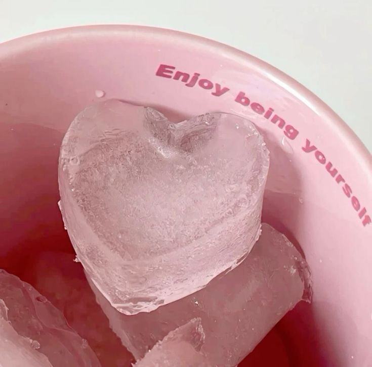 ice cubes in a pink bowl with a heart