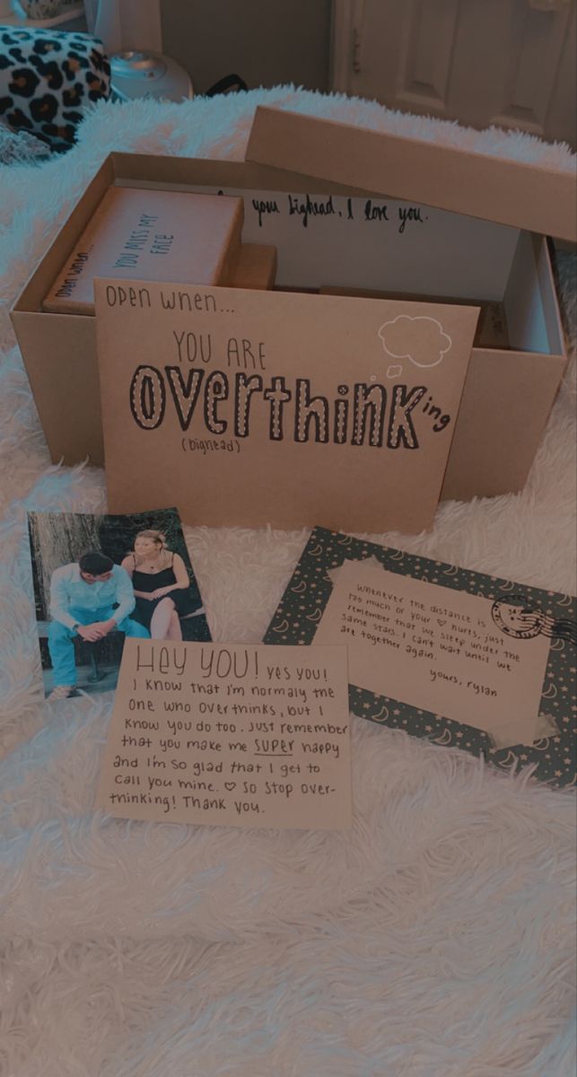 some cards are in a box on a white furnishing area, and there is an open card that says you are overthink