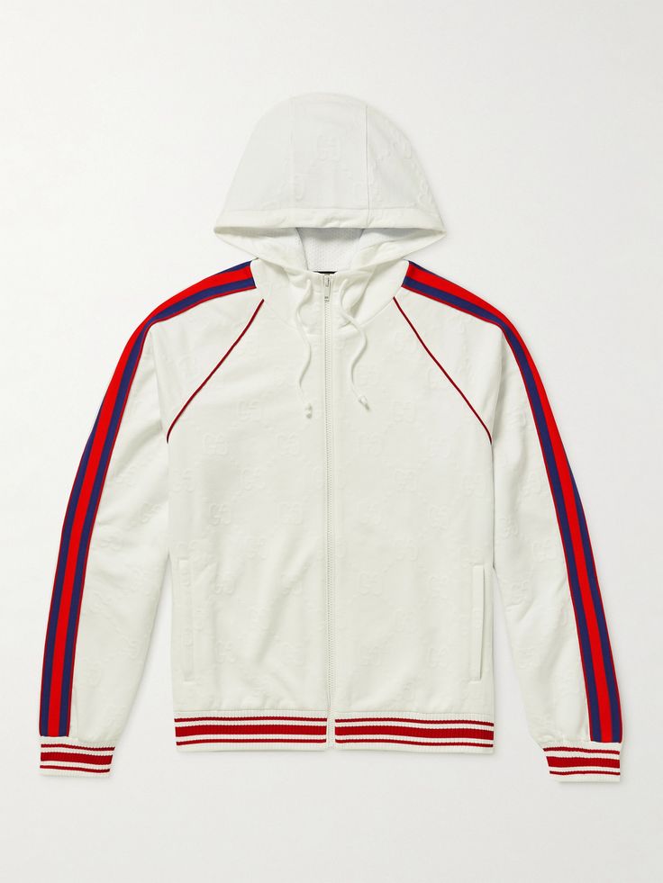 Creative Director Alessandro Michele often references retro athletics styles in Gucci's clothing. This hooded bomber jacket is jacquard-knitted with the house's logo and traced along the sleeves with signature striped webbing. It'll offset relaxed tailoring nicely. Gucci Hooded Sweatshirt With Ribbed Cuffs, Gucci Sweatshirt With Drawstring Hood For Fall, Casual Gucci Outerwear With Drawstring Hood, Gucci Long Sleeve Outerwear With Drawstring Hood, Gucci Hooded Outerwear With Drawstring, Gucci Outerwear With Drawstring Hood For Fall, Gucci Winter Outerwear With Drawstring Hood, Gucci Sporty Hoodie With Drawstring Hood, Gucci Designer White Outerwear