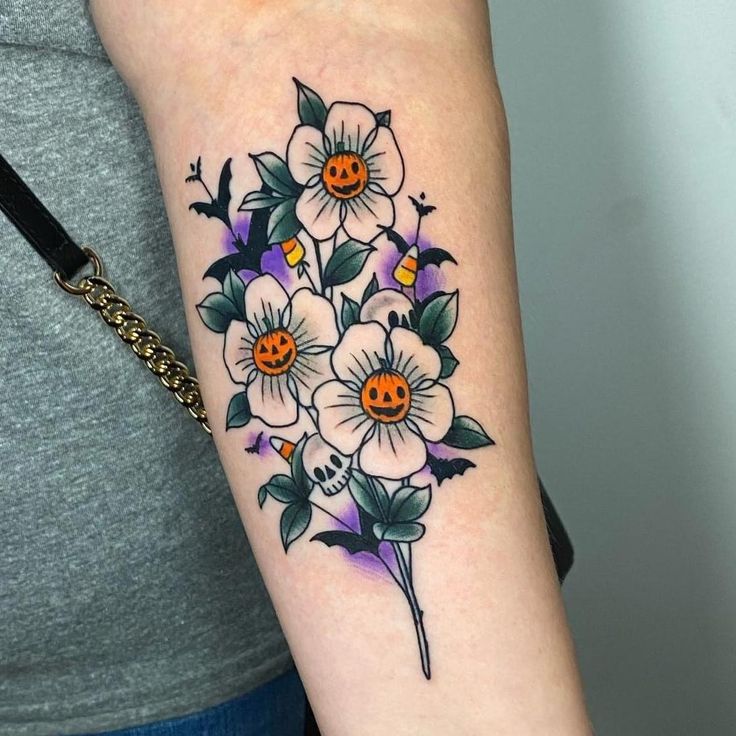 a woman with a flower tattoo on her arm