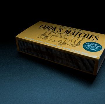 the cook's matches box sits on a blue surface