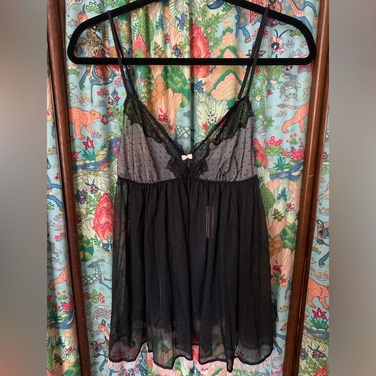 Nwt Victoria’s Secret Lingerie Sz Medium Sheer With Open Back Adjustable Straps Black With Pink Ruffle/Accents Excellent Condition Non Smoking Home Victoria's Secret Camisole For Loungewear, Victoria's Secret Sheer Nightgown For Loungewear, Black Sheer Camisole For Loungewear, Victoria's Secret Lace Trim Camisole For Night, Black Sheer Sleepwear For Loungewear, Sheer Black Sleepwear For Loungewear, Flirty Sheer Camisole Sleepwear, Victoria's Secret Sheer Sleepwear With Spaghetti Straps, Flirty Sheer Sleepwear From Victoria's Secret