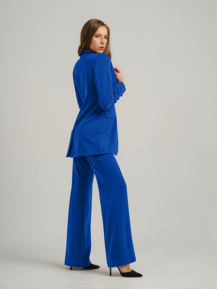 Sharply tailored to inject ensembles with confidence, these azure blue pants reinterpret the classic palazzo pair with a polished edge, and will fit perfectly in your capsule wardrobe. Expect a fusion of classic sophistication and contemporary style in this design, constructed from a luxurious stretch crêpe fabric.  This investment piece is versatile enough to style and wear repeatedly. It boasts a high waistband and full-length leg with draped hem detailing, creating a flattering elongated silhouette.  Wear it with its matching Royal Azure Timeless Classic Blazer and Royal Azure Fitted Satin Shirt to complete this signature look. Hand wash only. Wash inside out with like colours. Do not wring or twist. Do not tumble dry. Iron at 160°C max or use press cloth. Do not bleach. Professional dr Blue Wide Leg Pants For Work, Tailored Blue Wide Leg Pants For Formal Occasions, Tailored Wide Leg Blue Pants For Formal Occasions, Elegant Blue Wide Leg Pants For Business Casual, Fitted Blue Wide Leg Pants For Business Casual, Blue Fitted Wide Leg Pants For Business Casual, Elegant Blue Wide Leg Pants, Blue Straight Pantsuit For Work, Tailored Elegant Blue Bottoms