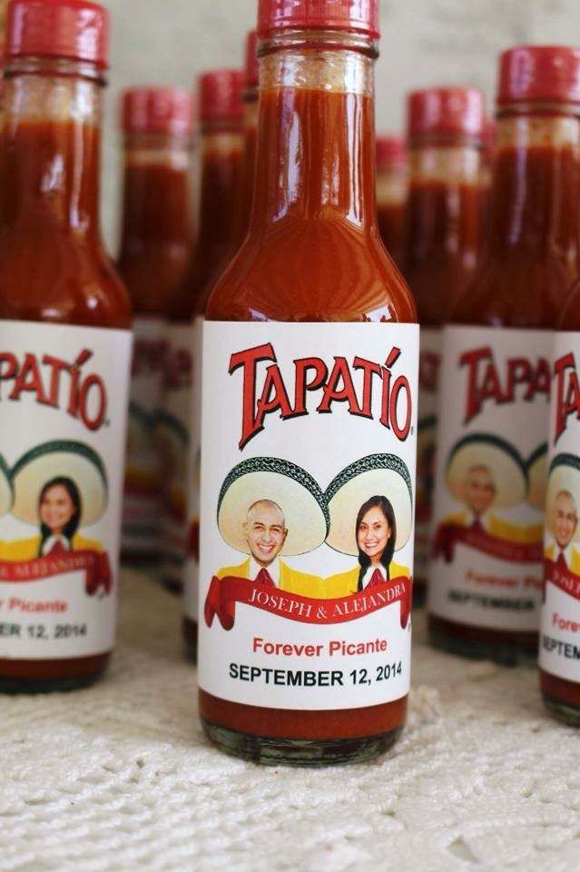 several bottles of hot sauce sitting next to each other