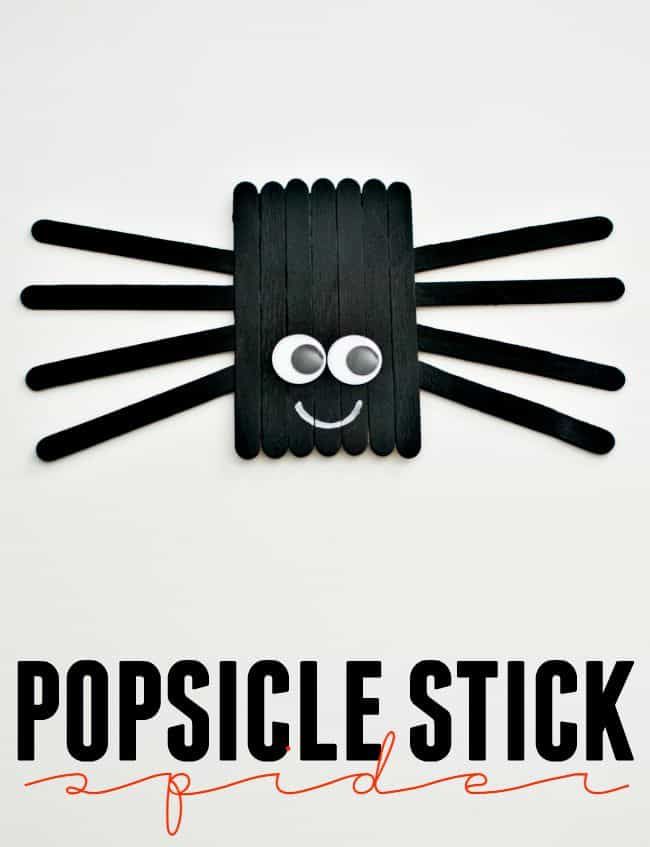 the popsicle stick logo is made out of black sticks and has a cat's face on it