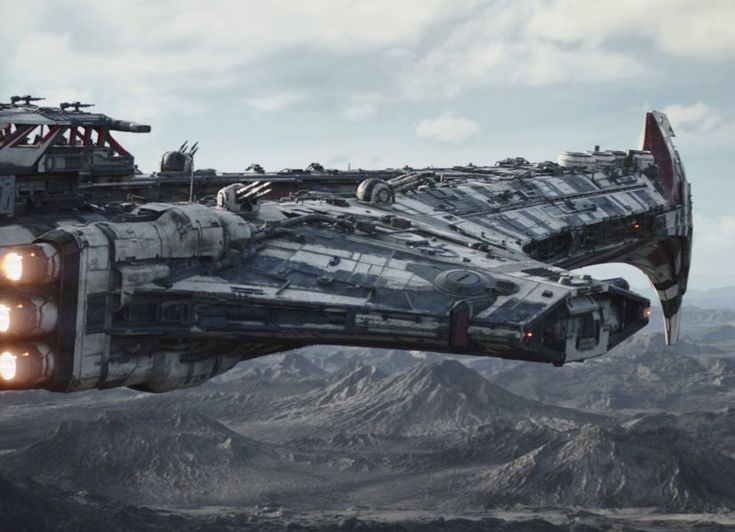 a sci - fi fighter jet flying through the sky with mountains in the back ground