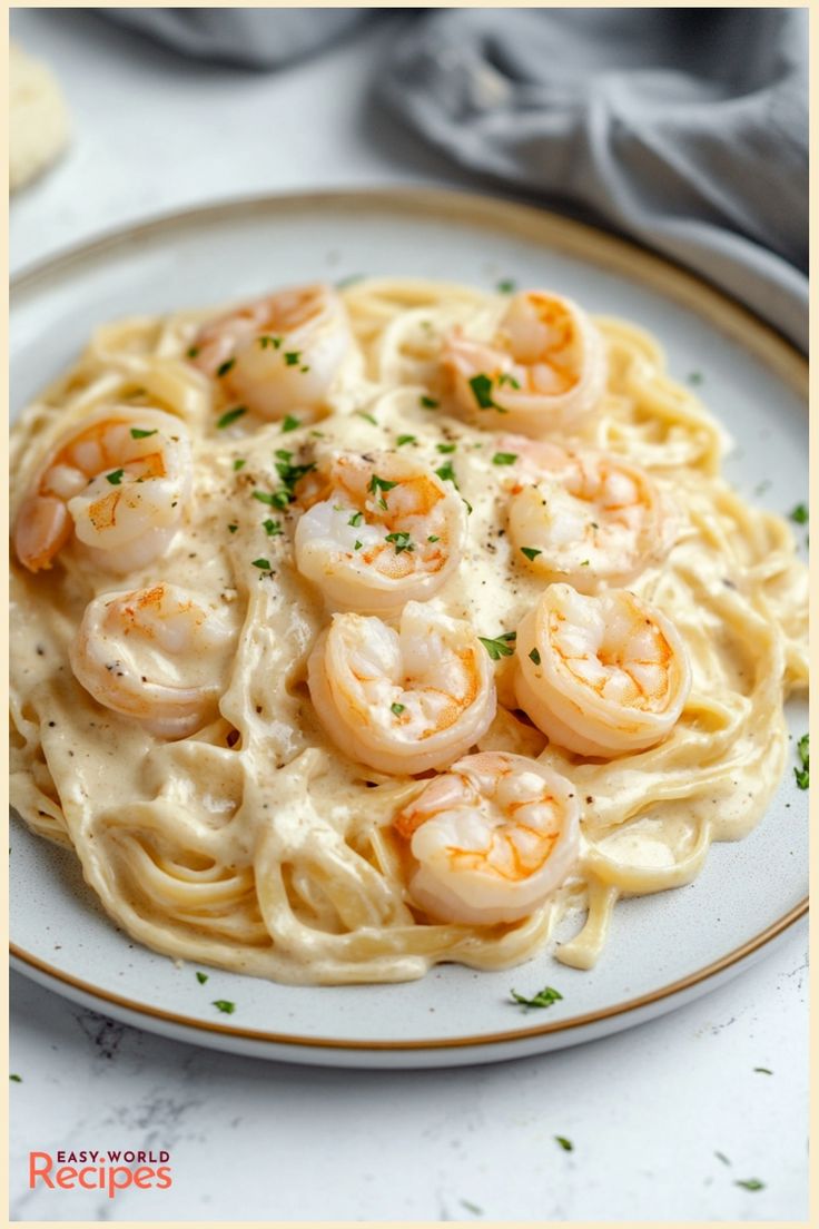 pasta with shrimp and cream sauce on a plate