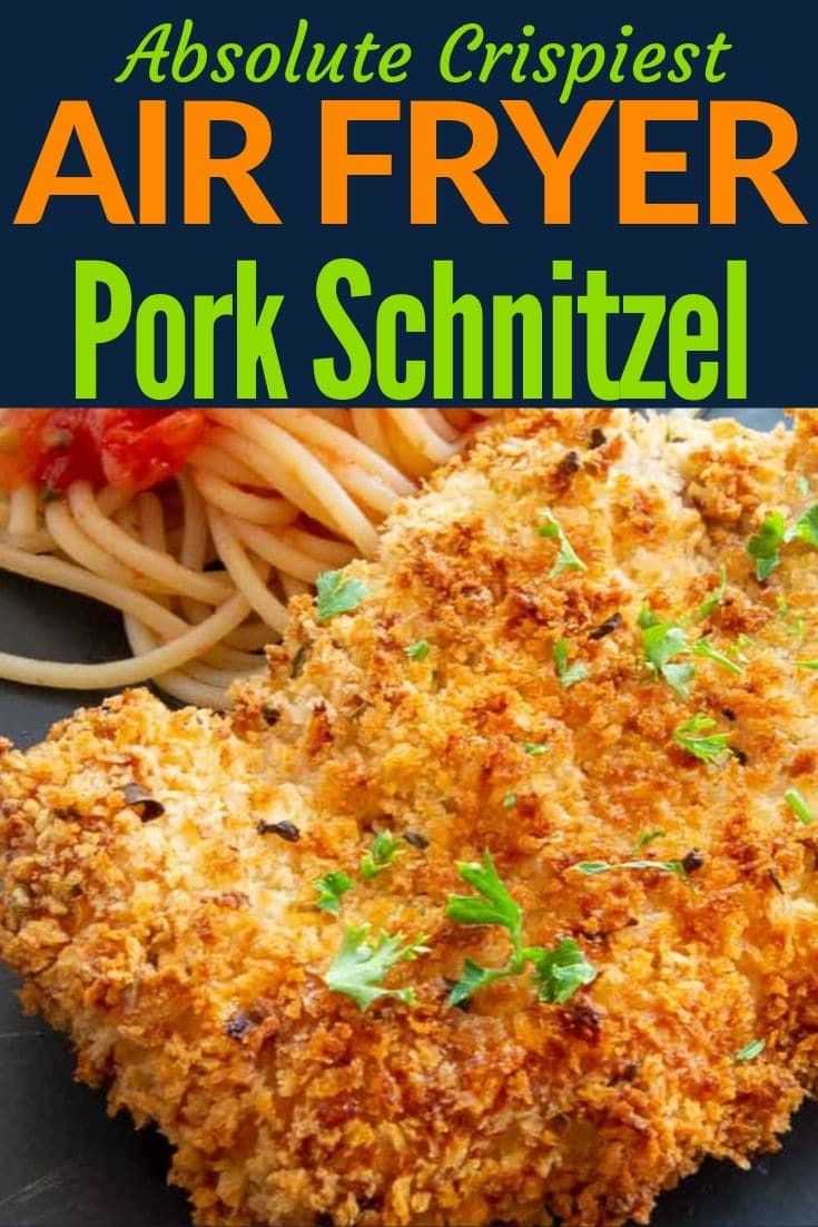 an air fryer pork schnitzel on a plate with spaghetti and sauce