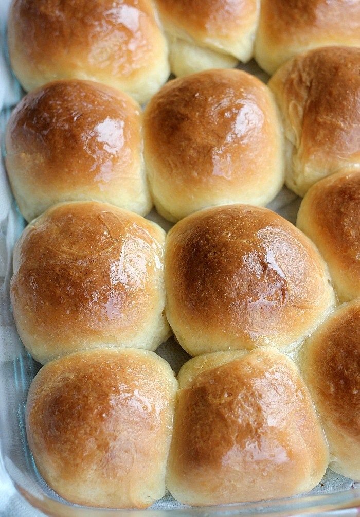 a glass baking dish filled with bread rolls