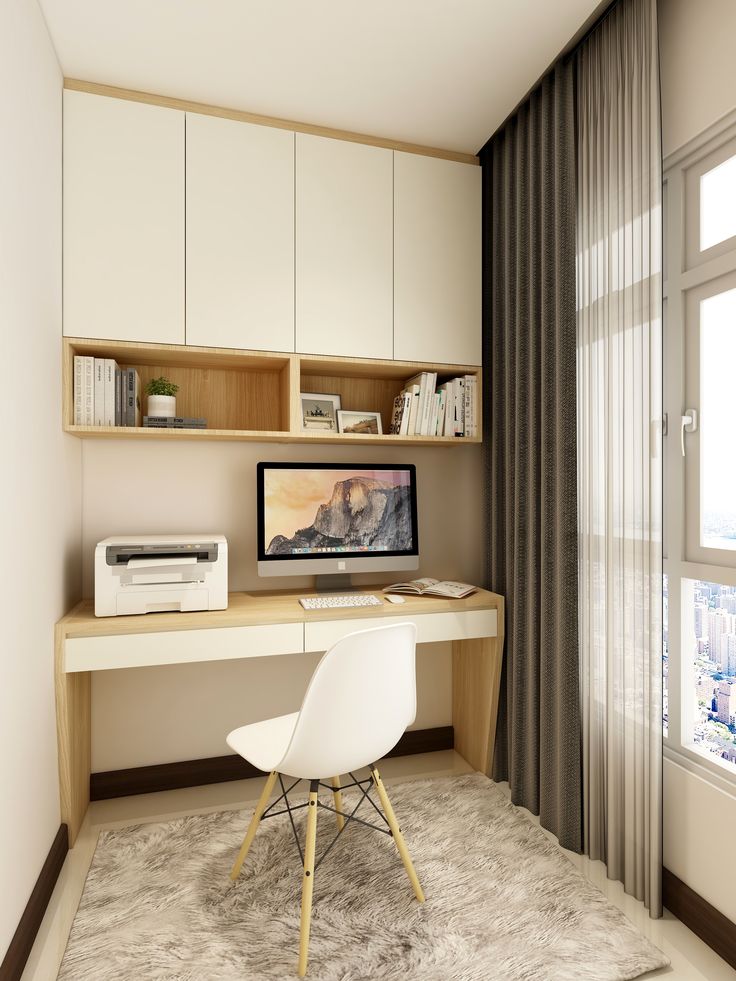 a desk with a computer and printer on it in front of a window overlooking the city