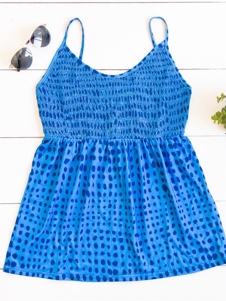 Cute, simple, and stylish... need we say more. The smocked top, beautiful pattern, and soft fabric make this tank stand out in a crowd. Note: Smocking is only on the front of the tank. The back is solid. Size Small 0-4 Medium 6-8 Large 10-12 XL 12-14 Summer Tank Top With Smocked Back, Beach Cotton Tank Top With Smocked Back, Cotton Tank Top With Smocked Back For Beach, Cotton Tank Top With Smocked Bodice For Vacation, Summer Tank Top With Smocked Back For Vacation, Casual Smocked Back Tank Top For Vacation, Sleeveless Smocked Back Tank Top For Vacation, Casual Cami Smocked Top, Sleeveless Tank Top With Smocked Back For Vacation