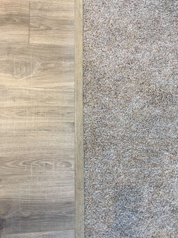 two pieces of wood are laying next to each other on the floor in this photo