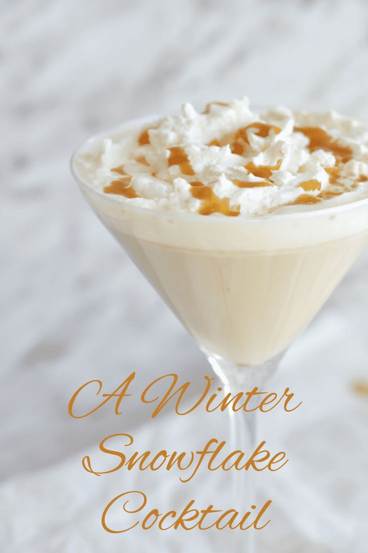 a drink in a martini glass with whipped cream on top and the words, a winter snowflake cocktail