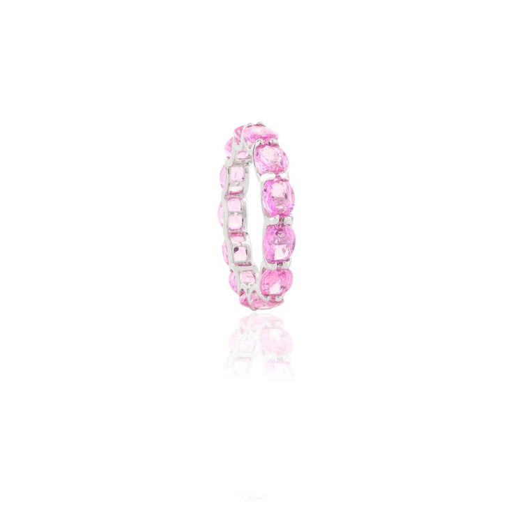 This is part of Chairish’s Fine Jewelry assortment.  Natural 4.96 Carat Pink Sapphire Eternity Band Ring for Her in 14K Gold featuring natural pink sapphire of 4.96 carats. The gorgeous handcrafted ring goes with every style. Sapphire stimulates concentration and reduces stress. Designed with oval cut pink sapphire set in continuation making a band that makes it a perfect fit to wear it on your occasion or style it with any of your basic outfit to give it a glam. This is a perfect Handmade Jewel Luxury Pink Oval Sapphire Ring, Pink Sapphire Ring With Halo, Luxury Pink Halo Jewelry, Elegant Pink Sapphire Stackable Ring, Pink Diamond Ring With Round Band In Fine Jewelry, Fine Jewelry Pink Diamond Ring With Round Band, Pink Diamond Ring With Round Band, Elegant Pink Gemstone Eternity Band, Pink Sapphire Halo Ring Jewelry