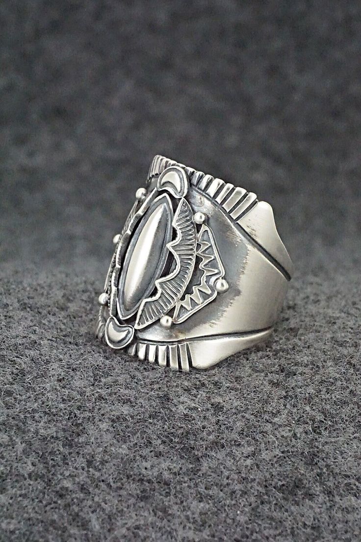 This finely crafted sterling silver ring was made by Navajo silversmith Derrick Gordon. The back is signed Derrick and stamped sterling.Size: 11Length: 1"Free shipping on all orders! We ship with USPS and always include tracking. All orders ship within a day of payment.Returns are accepted up to 30 days after you receive your order. Just send us a message. Our shop offers cash back or store credit. The item must be returned in new condition. Southwestern Silver Open Ring Jewelry, Southwestern Style Silver Open Ring Jewelry, Silver Southwestern Style Rings, Southwestern Style Untreated Silver Rings, Southwestern Silver Rings Collectible, Southwestern Silver Collectible Rings, Collectible Southwestern Silver Ring, Bohemian Silver Rings With Polished Finish, Silver Turquoise Concho Ring In Sterling Silver