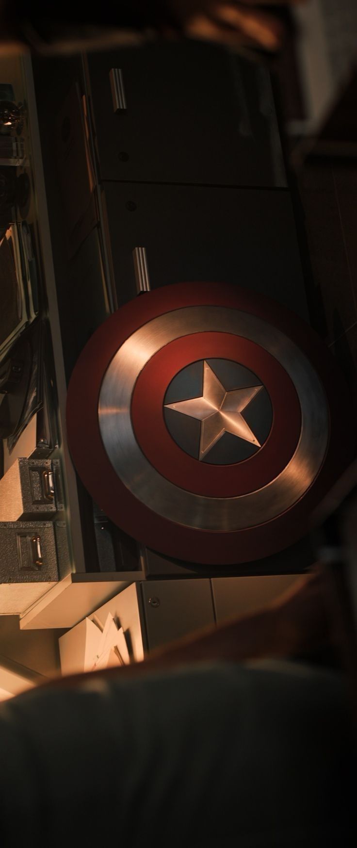 the captain's shield is on display in front of an oven and stove top