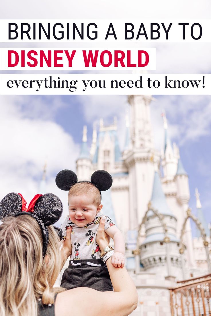 a woman holding a baby in front of a castle with the words bringing a baby to disney world