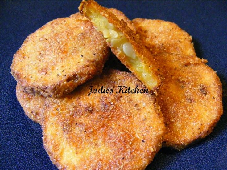 three fried food items on a blue surface