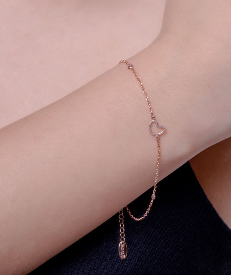 This gold heart is made of solid gold, and is set with 3 pink CZ stones! Express your love with this stylish and captivating bracelet! A perfect love gift for her. ✔ Made to Order ✔ Gold Kt: 9k-14K-18k ✔Metal stamp: 375-585-750 ✔ Available Gold Color: Rose Gold, Yellow Gold, White Gold ✔ Stone Cut: Round ✔ Number of Stones: 3 ✔ Setting Type: Prong ✔ Type of stones: CZ ✔ Bracelet size: Available in any lengths ( double link is an option) ✔ Dimensions (heart): 6,5MM ✔ Gold weight: 1 grams * ✔ Read Sterling Silver Heart Name Bracelet, Heart-shaped Sterling Silver Name Bracelet, Dainty Heart-shaped Cubic Zirconia Bracelet, Dainty Cubic Zirconia Heart Bracelet, Fine Jewelry Rose Gold Heart Bracelets, Rose Gold Heart Bracelets Fine Jewelry, Valentine's Day Heart Charm Bracelet In Cubic Zirconia, Valentine's Day Heart Charm Bracelet With Cubic Zirconia, Dainty Tarnish Resistant Heart Bracelet Gift