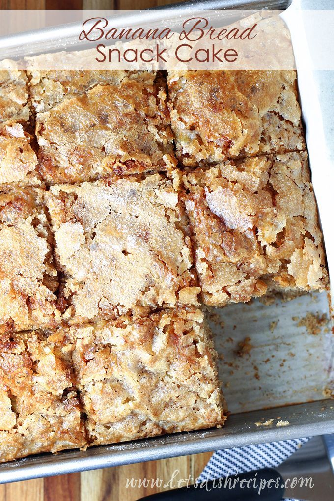 banana bread snack cake cut into squares in a pan on top of a wooden table