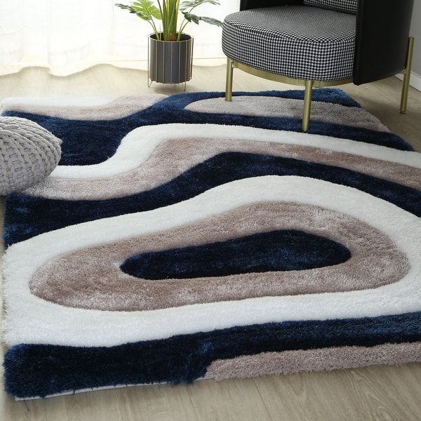 a living room with a chair and rug on the floor