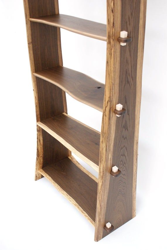 a wooden shelf with three shelves on each side